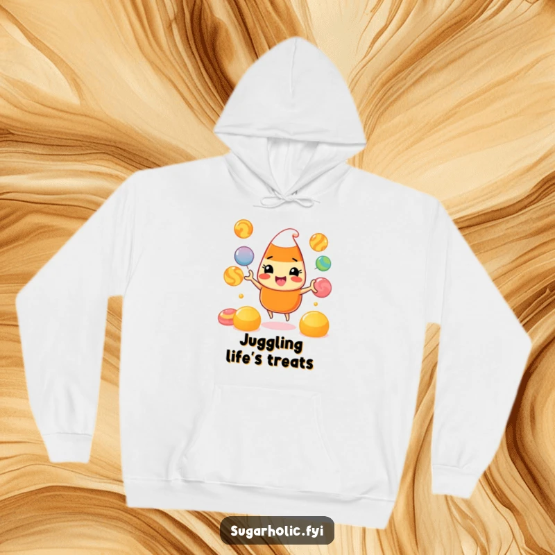 Funny Hoodie: A comfortable hooded sweatshirt displaying a beaming candy corn character expertly juggling vibrant gumdrops, radiating playful energy.
