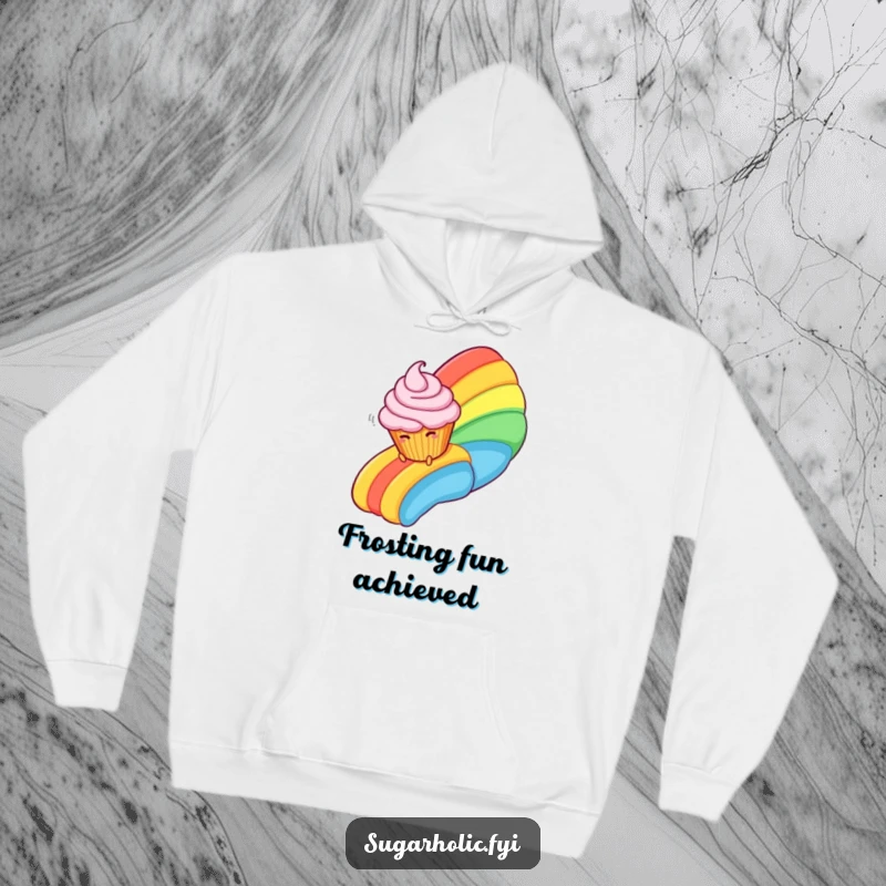 Funny Hoodie featuring a happy cupcake character giggling as it slides down a fantastical rainbow made of swirls of frosting.