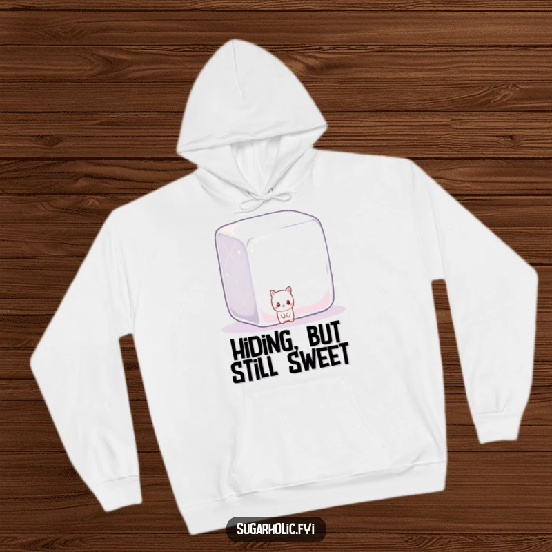 Funny shy candy character peeking cautiously from behind a giant, sparkly sugar cube, featured on a cozy hoodie.