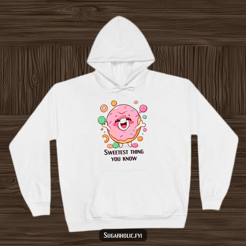Funny donut hoodie featuring a smiling character joyfully juggling colorful candy, cozy and hilarious gift for foodie friends and sweet lovers.