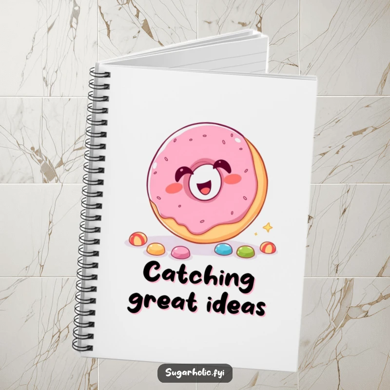 Funny Notebook with a giggling donut catching candy through its hole, perfect for jotting notes.