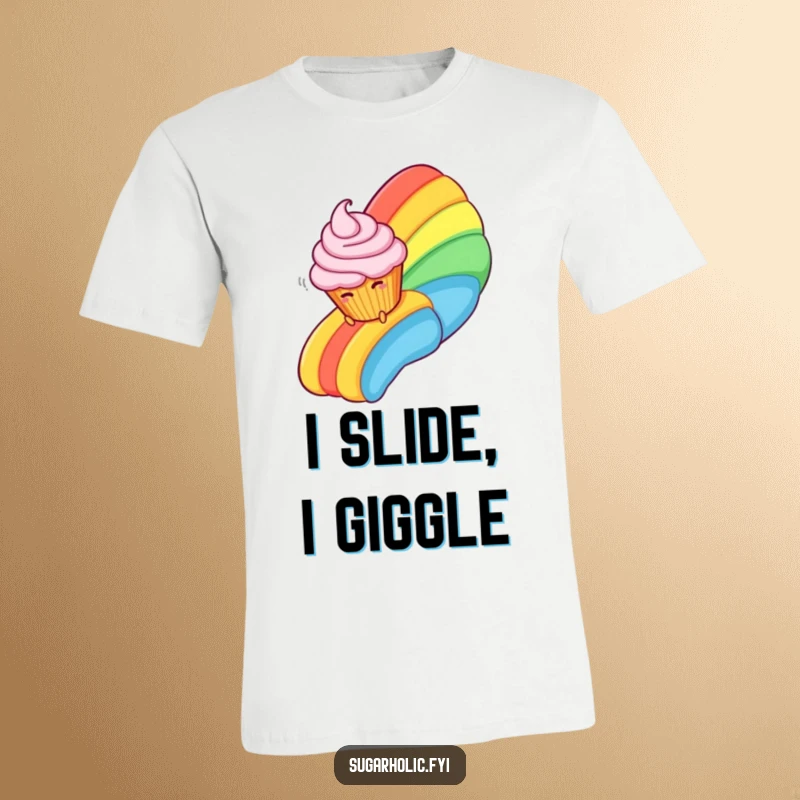 Funny T-Shirt with a laughing cupcake character having a blast sliding down a colorful rainbow constructed from luscious frosting.