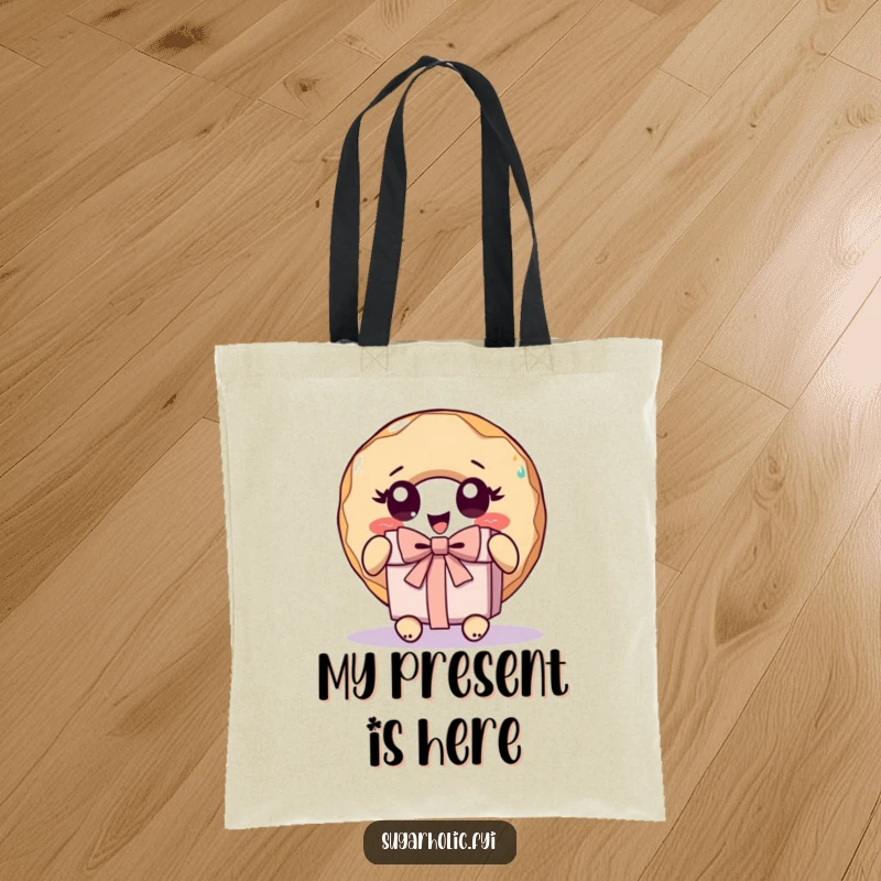 Funny donut character with wide eyes, excitedly unwrapping a gift on a durable and humorous tote bag.